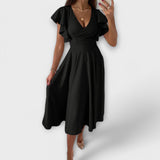 Elegantes V-Ausschnitt-Kleid mit fließender Silhouette