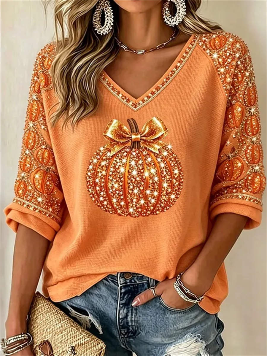 Olivia | Von Halloween inspirierte, orangefarbene Bluse mit Kürbismuster und V-Ausschnitt und Dreiviertelärmeln