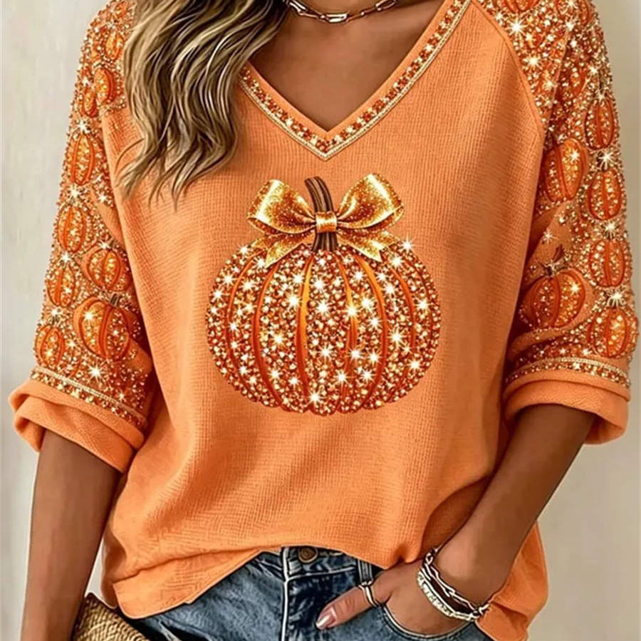 Olivia | Von Halloween inspirierte, orangefarbene Bluse mit Kürbismuster und V-Ausschnitt und Dreiviertelärmeln