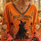 Callie | Halloween-inspiriertes orangefarbenes Hexen-Langarmoberteil mit floralem Buchstabendruck und V-Ausschnitt