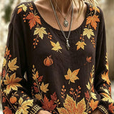 Vivian | Dunkelbraune Halloween-Bluse mit Ahornblatt und Kürbismuster, Rundhalsausschnitt und langen Ärmeln