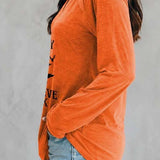 Sadie | Halloween-inspirierte orange Hexen-Bluse mit Buchstaben-Print und V-Ausschnitt