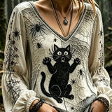 Mariana | Halloween-inspirierte, mehrfarbige Gothic-Bluse mit Katzen- und Spinnenmuster und V-Ausschnitt und Puffärmeln