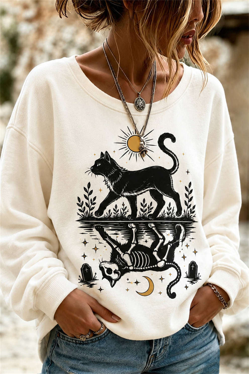 Kiara | Halloween-inspiriertes, langärmliges Rundhals-Sweatshirt mit cremefarbenem schwarzen Katzenskelett-Print