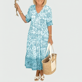 Constance | Midi-Kleid mit floralem Border-Print und gestuftem Saum